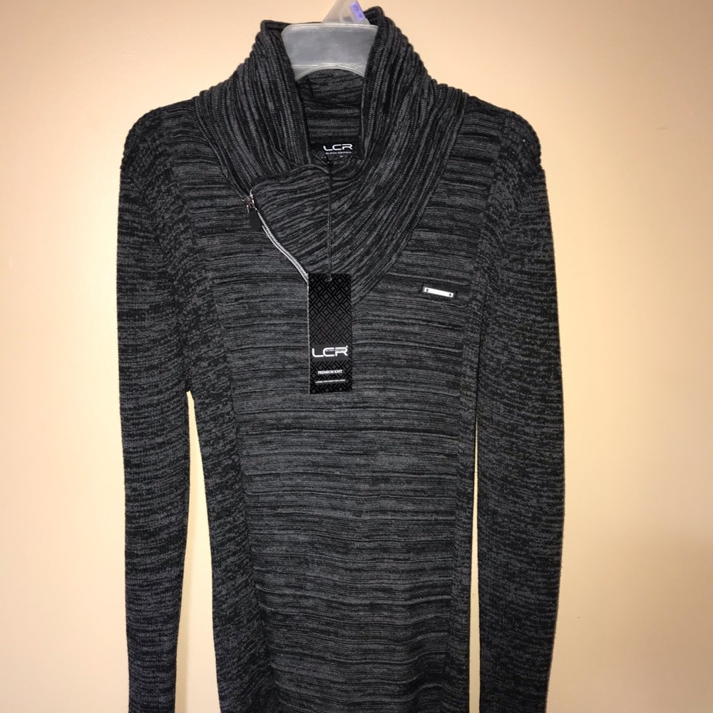 Grey Stretchy Turtle Neck sweater.